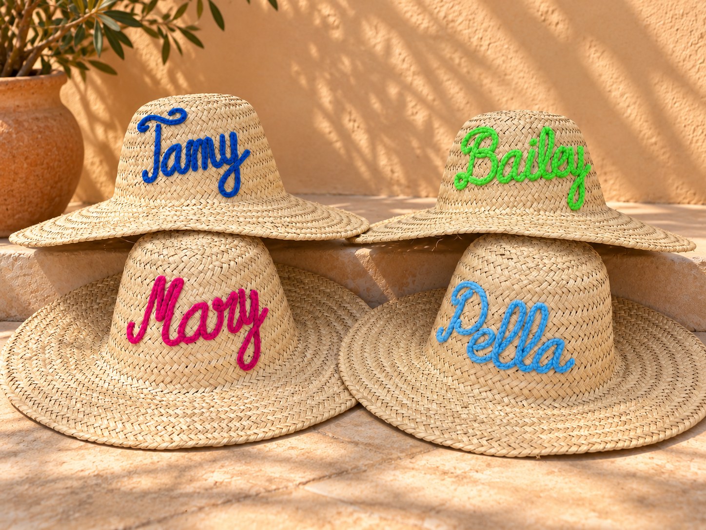 Straw hats with names in wool